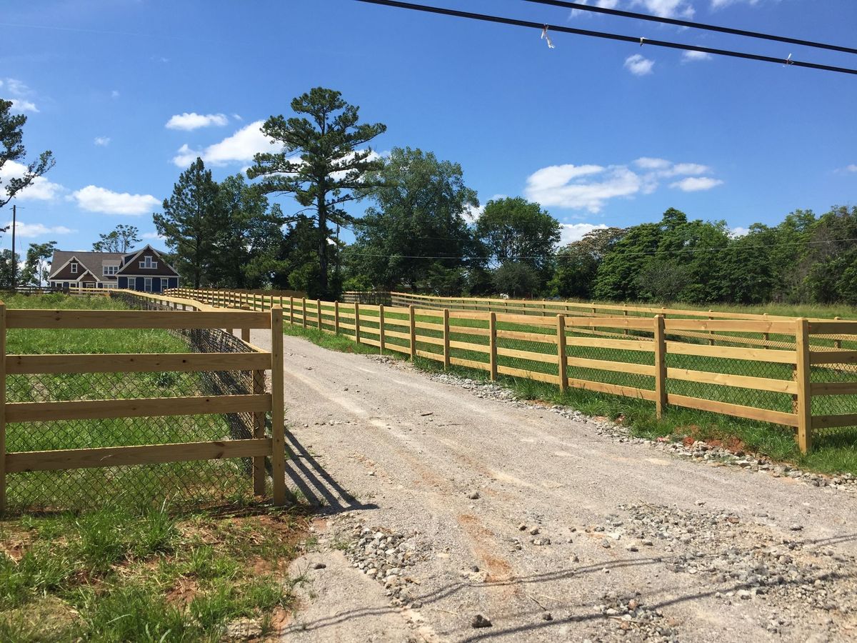 4 Rail With Black Vinyl fence installed by Shelby Fence Company in Alabaster, AL