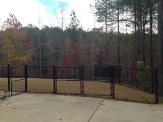 Black Vinyl Chain Link With Double Gate fence installed by Shelby Fence Company in Alabaster, AL