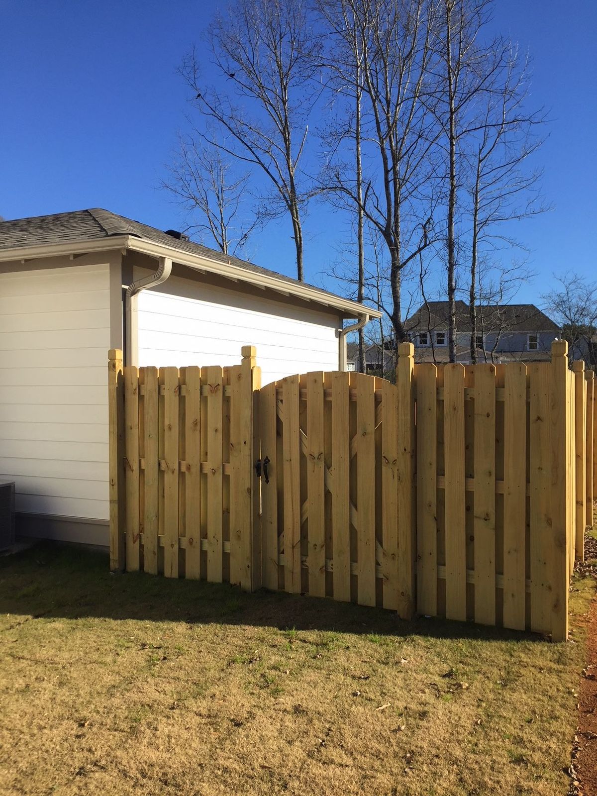 Shadowbox Straight With Single Arched Gate fence installed by Shelby Fence Company in Alabaster, AL