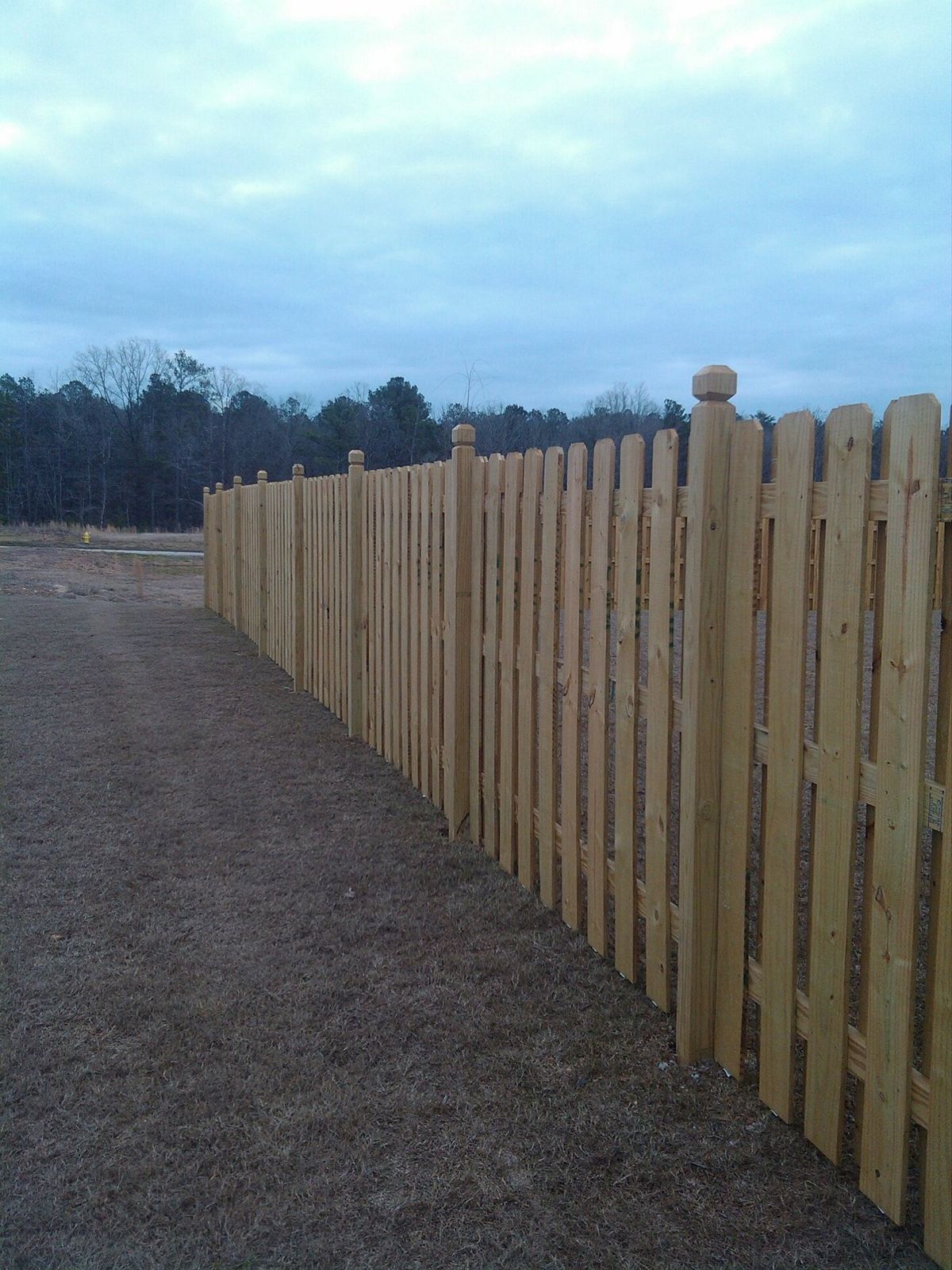 Wood privacy fence installation